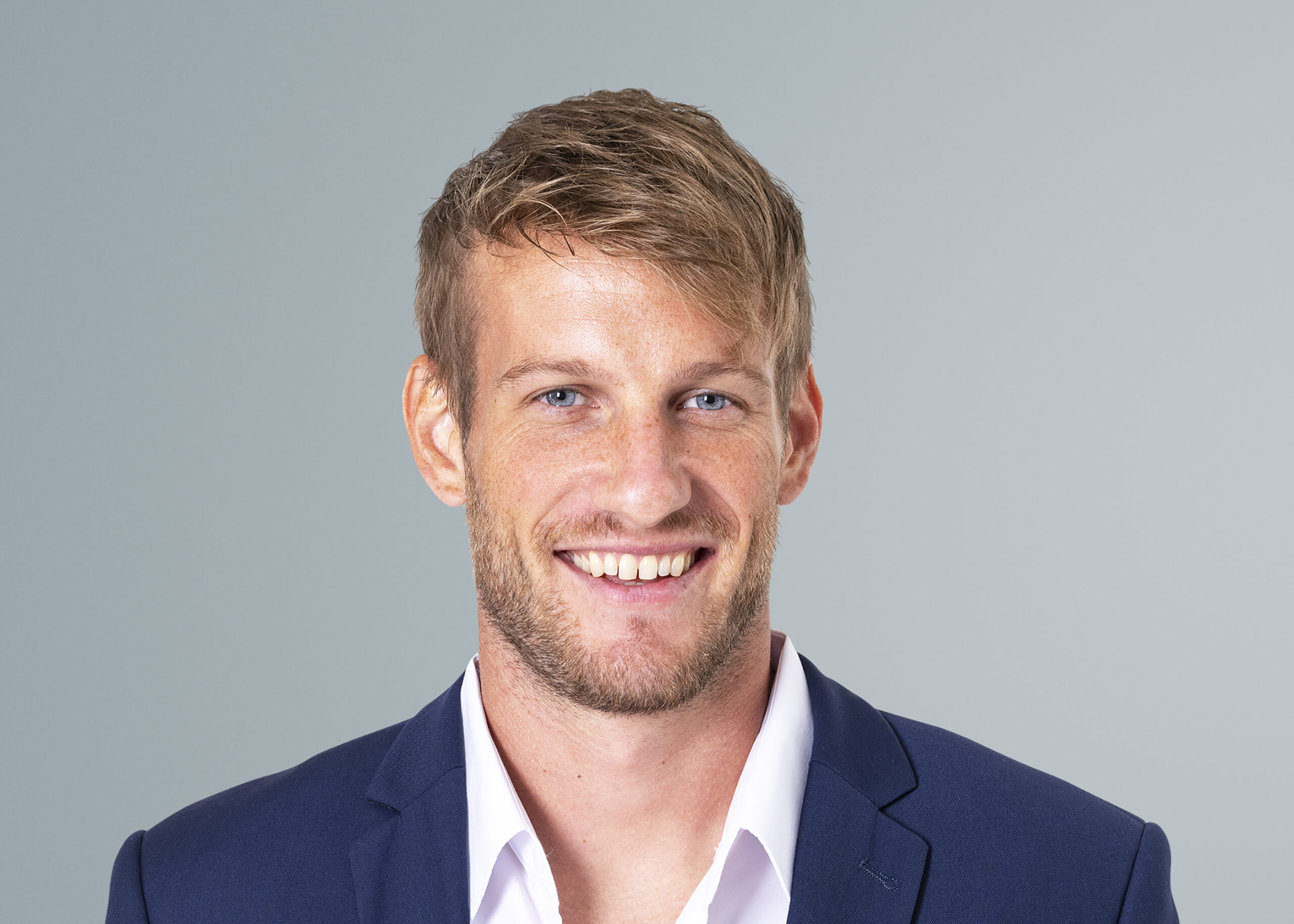 Smiling businessman face portrait, wearing suit